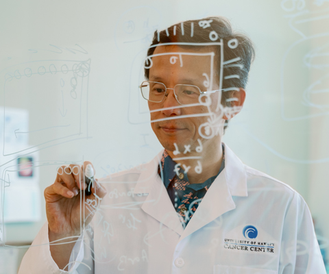 Researcher writing on board